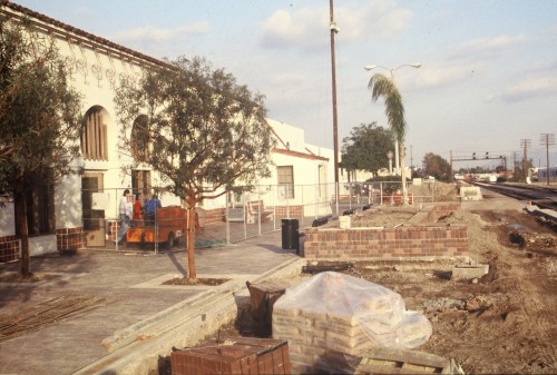 Trees and planters block the platform; staff obstruction was almost as bad.